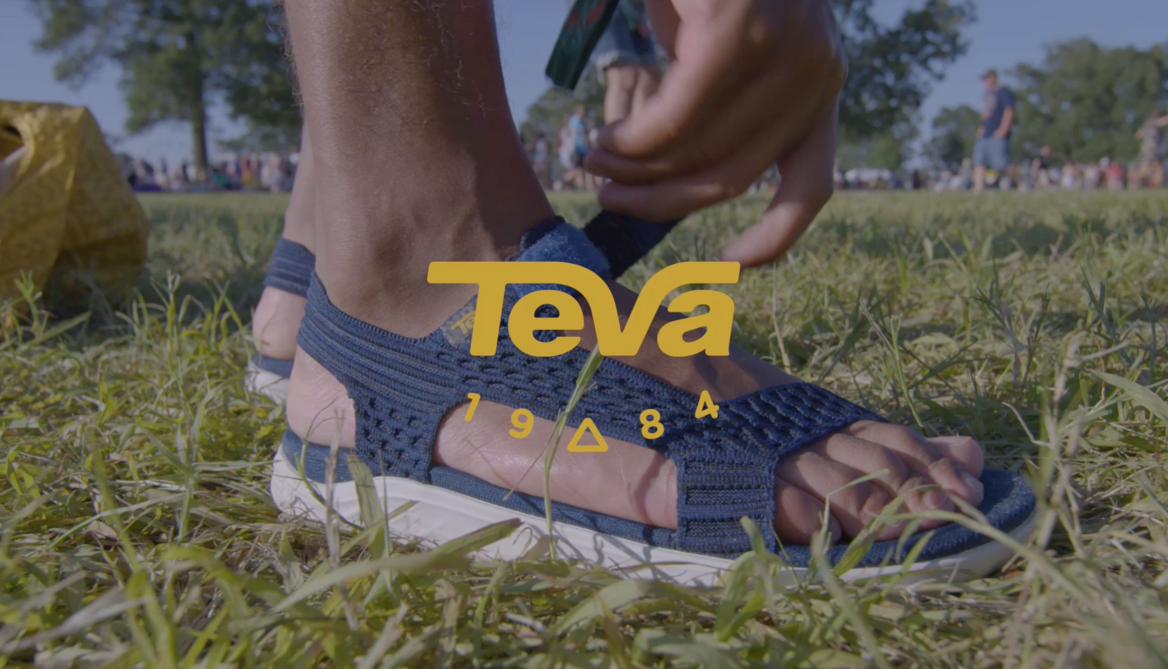 Teva logo over a photo of foot in a sandal